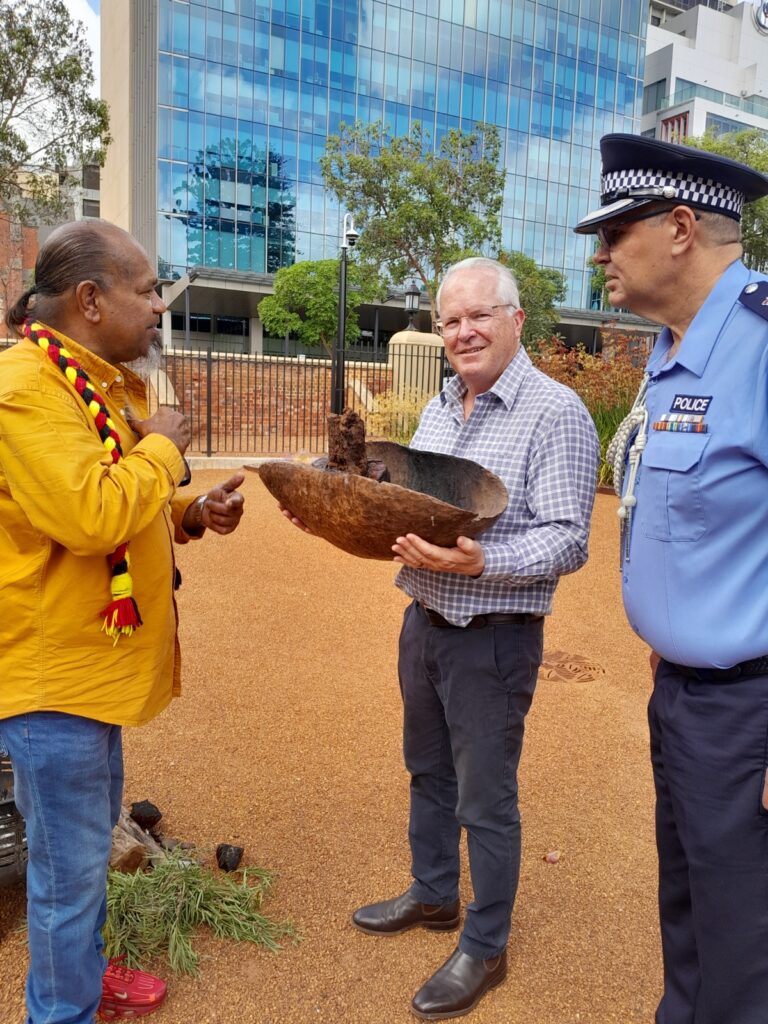 Vaughn McGuire with officials and WA Police at a smoking ceremony